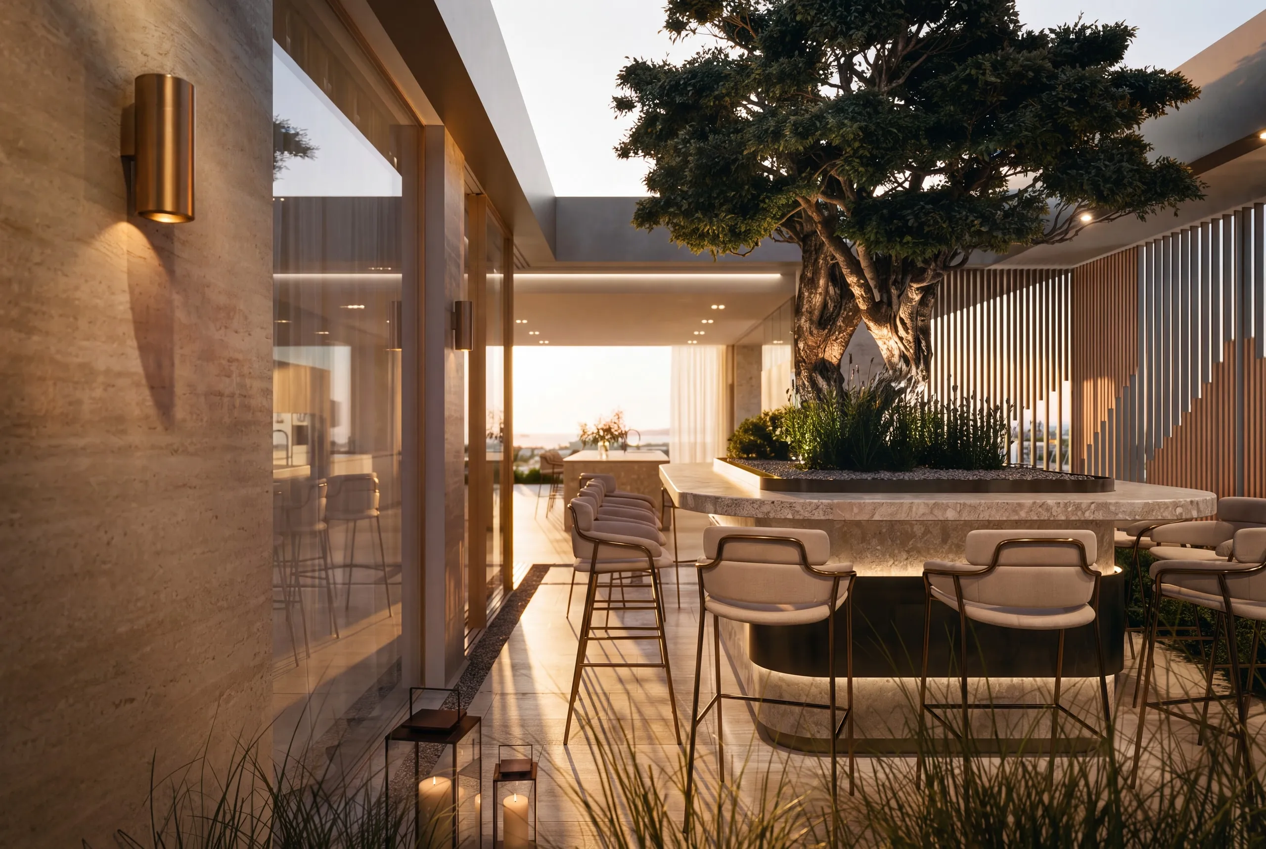 The Penthouse terrace bar at sunset: an olive tree growing from the counter, timber slats behind