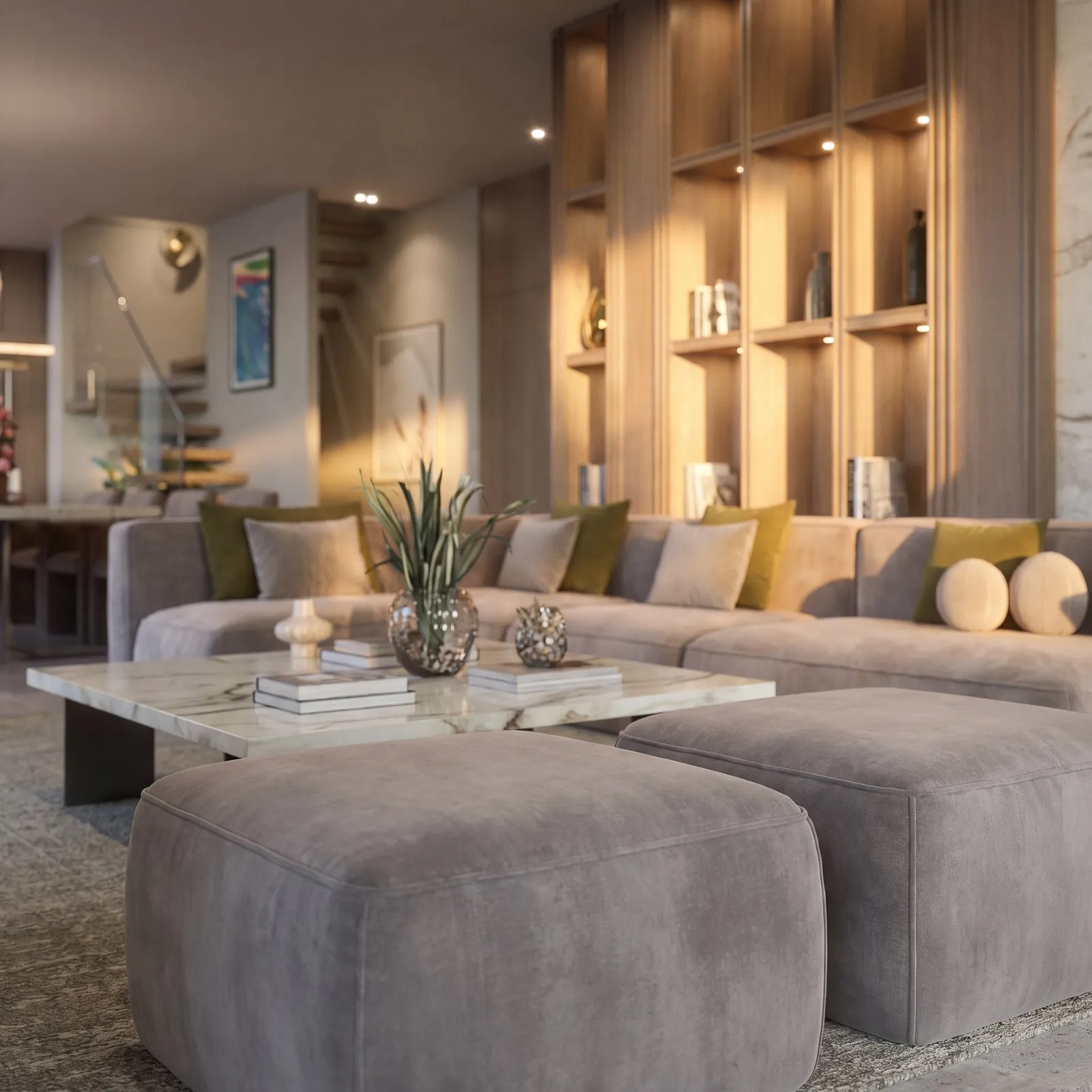 Softly lit shelves frame the long sofa.
